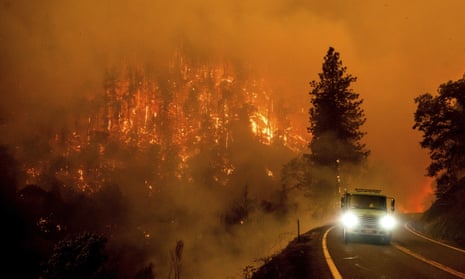 A firetruck drives along California Highway 96 as the McKinney Fire burns in Klamath National Forest, on 30 July 2022.