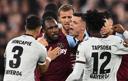 Michail Antonio of West Ham clashes with Edmond Tapsoba of Bayer Leverkusen leading to him being shown a yellow card during the Europa League quarter-finals.