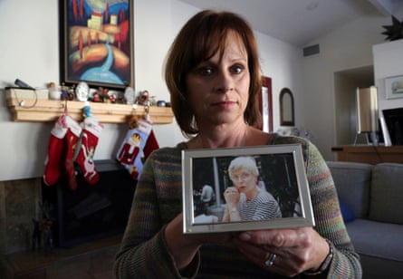 a women holding a photo