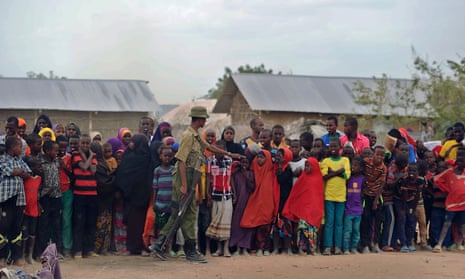 Refugees stand in line at Kenya’s sprawling Dadaab refugee complex.