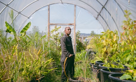 LeJeun “LJ” Holmes poses for a portrait at Planting Justice’s nursery in Oakland, Calif., on Wednesday, July 27, 2022. Holmes, who was incarcerated before joining Planting Justice, says that working in a garden has changed his life.
