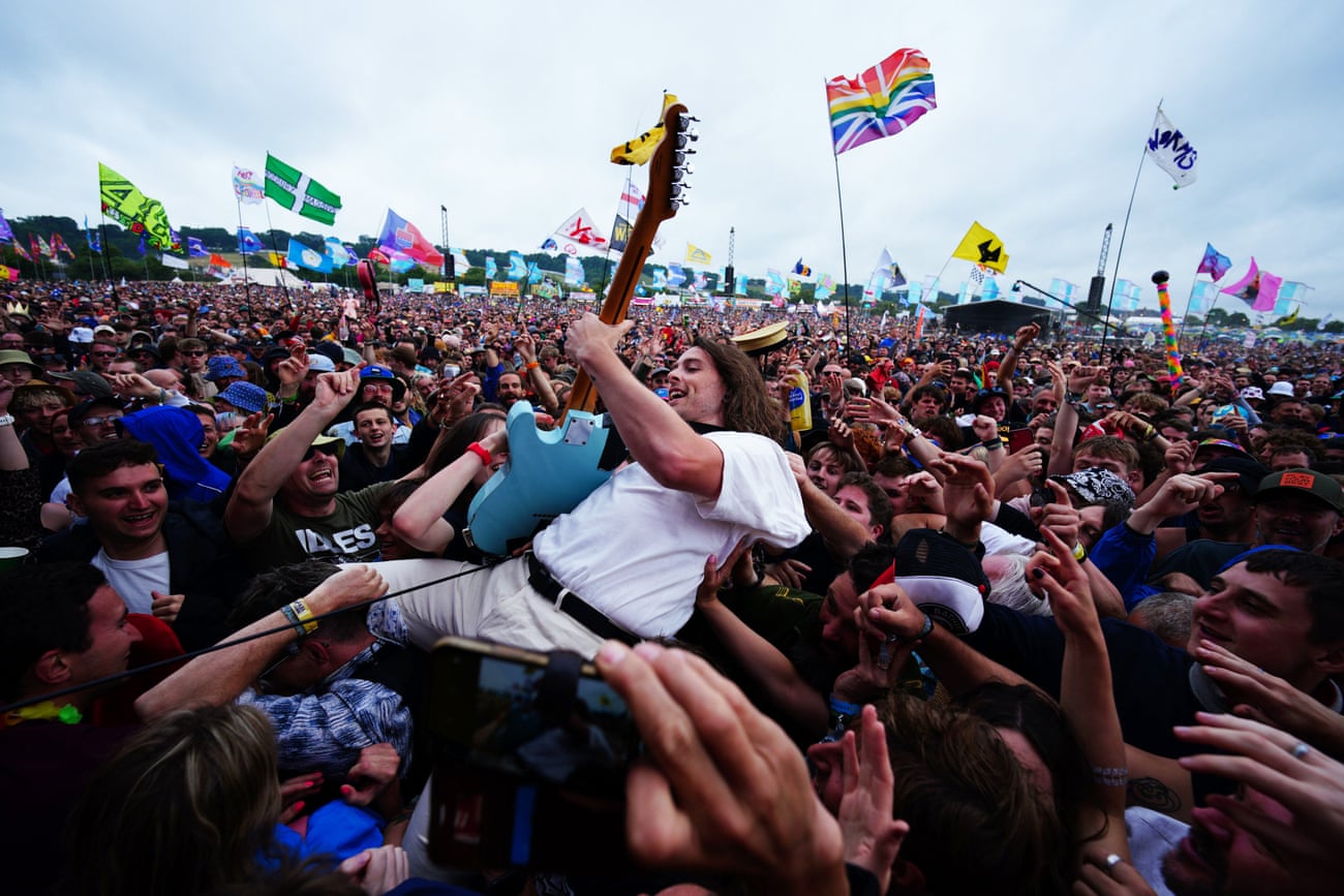 Lee Kiernan from Idles crowd surfs during their set on the Other Stage