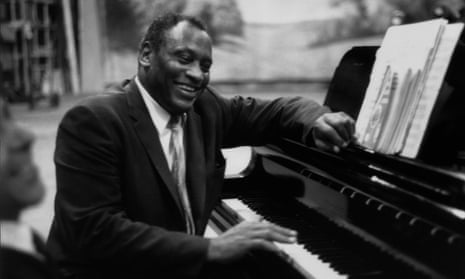 Paul Robeson in relaxed mood at the piano in 1958.