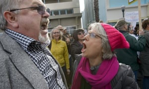 Trump supporter Lance Snead, left, is confronted by an anti-Trump protester, Louise Isaacson, during a rally in Roseville on Saturday.