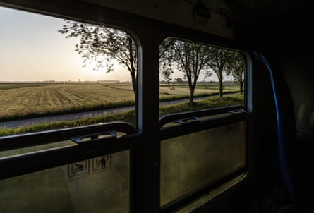 view of countryside through a train window.