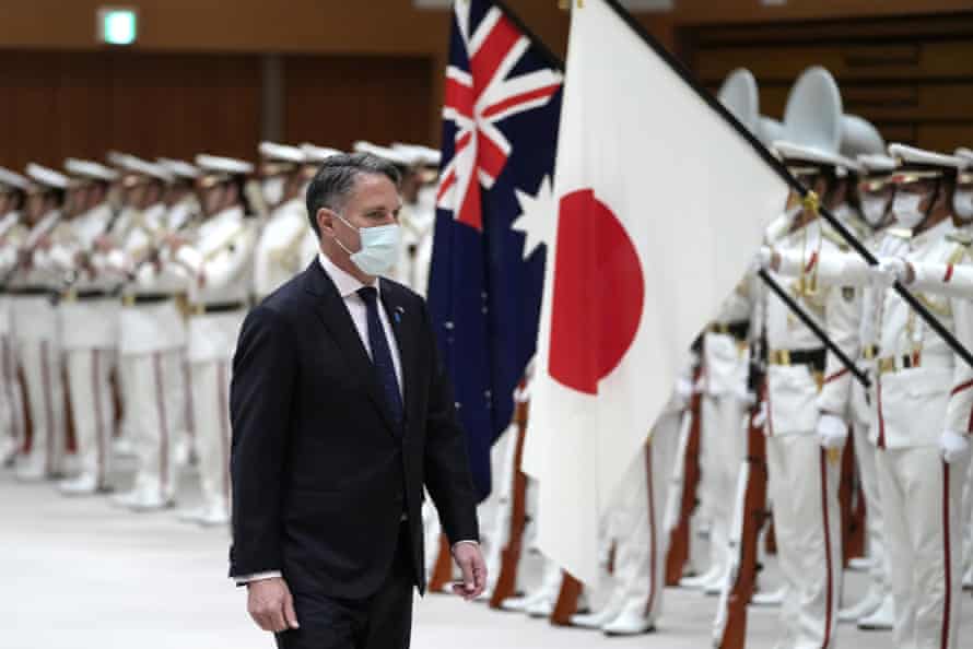 Australian deputy prime minister and defence minister Richard Marles inspects an honour guard prior to a meeting at the Ministry of Defence on Wednesday in Tokyo.