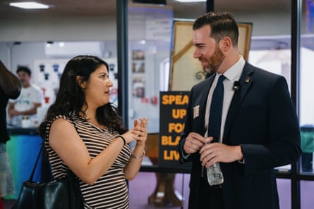 A woman and man speaking