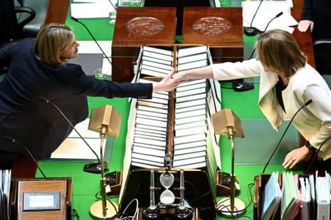 Jess Wilson, left, shakes hands with the Victorian premier, Jacinta Allan.