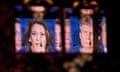 a broadcast of the presidential debate is reflected in a mirror