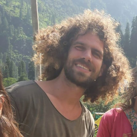 Hayim Katsman, with mop of hair and beard, looking happy