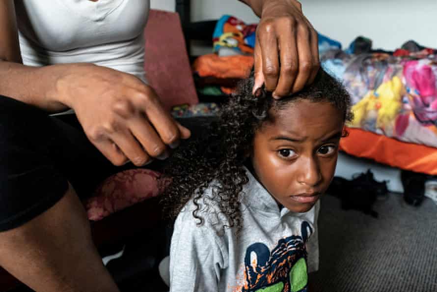 Cherokeena Robinson braids her son Mai’Kel’s hair in the morning in their room at their transitional house in San Pedro, California that they share with one or two other families at a time. Cherokeena lost her job during the pandemic and now relies on the organization Family Promise to help with housing, childcare, food, and counseling. Cherokeena and her son have been living in the transitional house since June 2020 where she pays $300 a month for rent for a private room until she can figure out her job and find a full private apartment of her own.