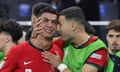 Tearful Cristiano Ronaldo is comforted by teammate Diogo Dalot during the break before extra time against Slovenia at Frankfurt Arena.