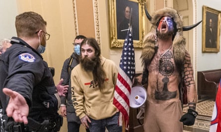 Trump supporters including QAnon conspiracy theorist Jacob Chansley, far right, during the storming of the US Capitol in January.