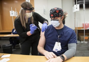 ER nurse George Biddle receives the Pfizer-BioNTech COVID-19 vaccine at the Ohio State University Wexner Medical Center.