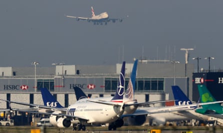 Planes land, taxi and unload at Heathrow airport.