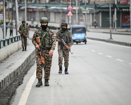 Indian paramilitary soldiers patrol along a road in Srinagar after Pakistan's military said India launched another wave of missiles targeting three air bases