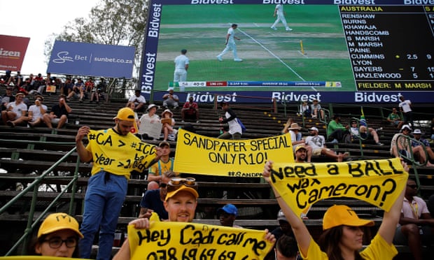 South Africa fans hold up banners taunting the Australia team on the first day of the fourth Test at the Wanderers in Johannesburg.