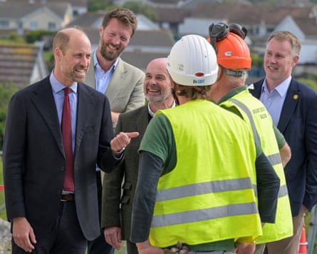 Prince William speaking to men in hi-vis and hard hats