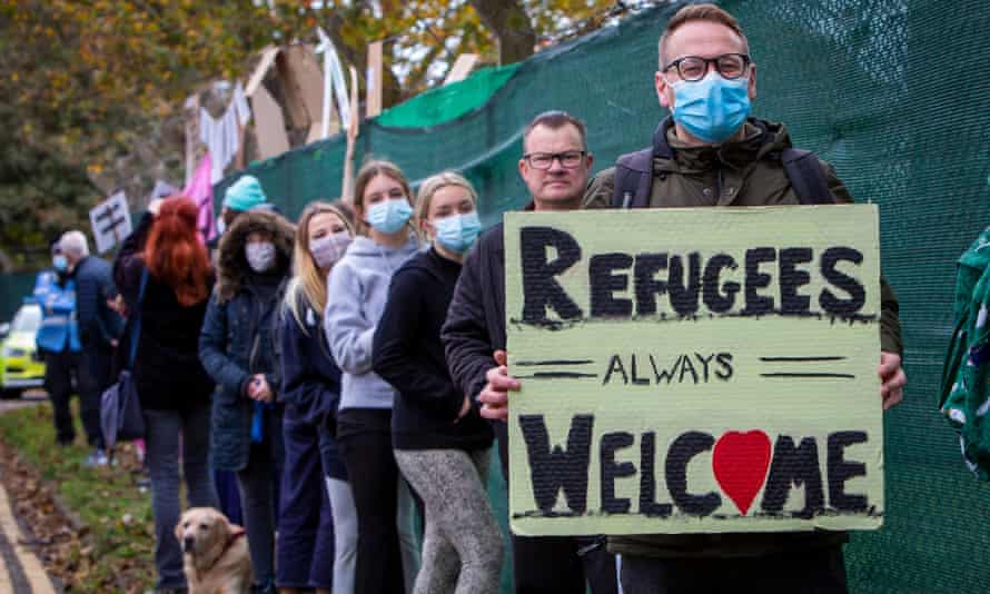 Folkestone Residents Welcome Refugees To Napier BarracksWelcome To Folkestone About 400 local residents and community groups including Kent Refugee Action Network and Samphire came together outside Napier Barracks to show the people staying there that they are welcome to the town on the 17th of October 2020 in Folkestone, United Kingdom. In September 2020 Napier Barracks a former military camp was transformed into an assessment and dispersal facility for 400 asylum seekers by the Home Office. (photo by Andrew Aitchison / In Pictures via Getty Images)