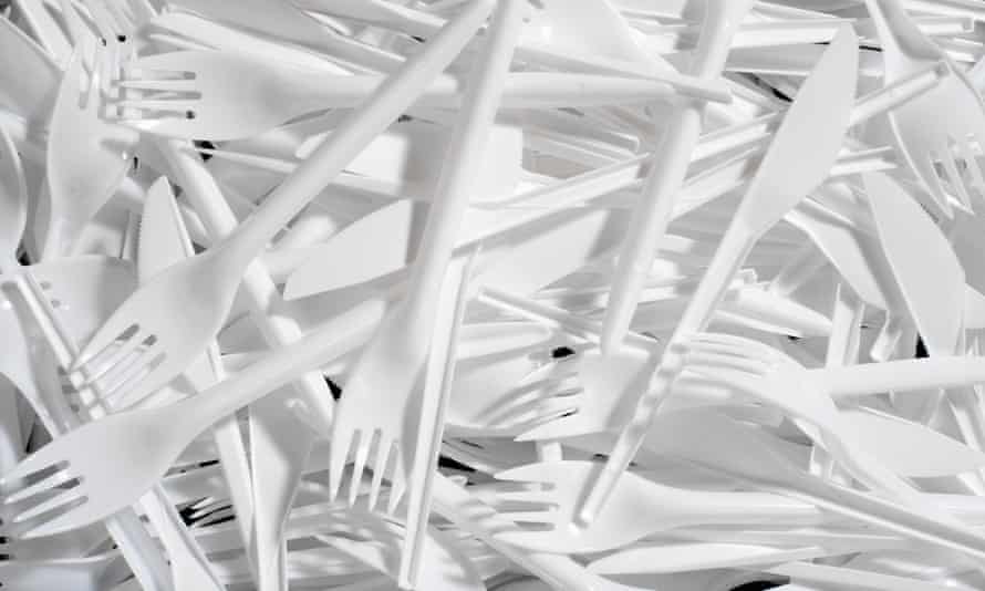 pile of white plastic cutlery