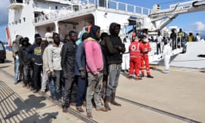 Migrants and refugees arrive in Messina, Sicily, following a rescue operation at sea by the Italian Coast Guard ship Diciotti in 2016.