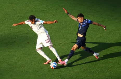 Lamine Yamal nips in ahead of Uruguay's Mathias Olivera.