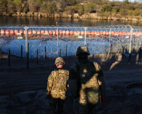 soldiers patrol a border