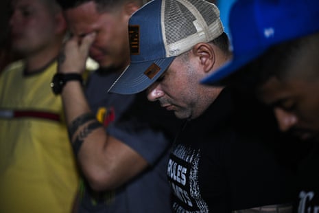 men attend a church service