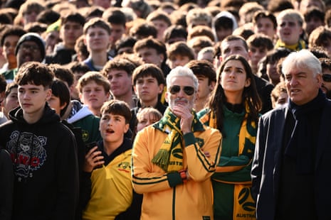 Craig Foster (centre) at Federation Square, in Melbourne