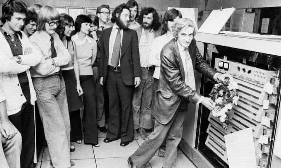 Tony Brooker placing a wreath at the closing-down ceremony for an early model of computer at Essex University, around 1972