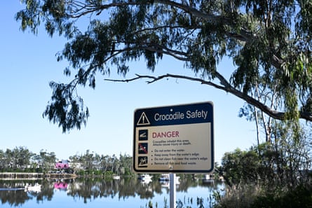 A crocodile safety sign along the Rockhampton riverside.