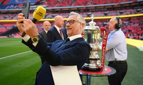 Gary Lineker takes a photo on his phone at Wembley in April 2022