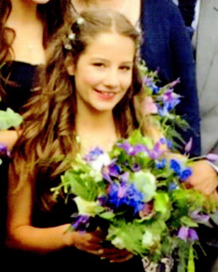 Molly when a bridesmaid, holding flowers