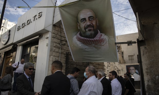 A memorial service in the West Bank for Nizar Banat, an outspoken critic of the Palestinian Authority who died while in custody in June 2021.