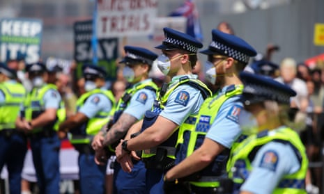 Police officers look on during an anti-vaccine mandate protest in Wellington.