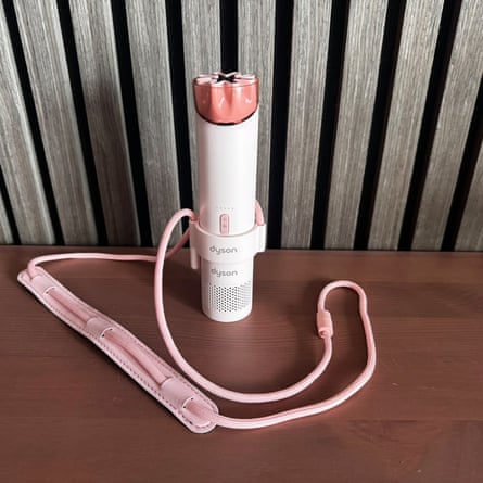 Dyson HushJet Mini Cool on a wooden tabletop.