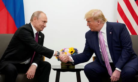 Trump with Putin at the summit in Osaka in June 2019. Grisham says she heard Trump say: ‘It’s for the cameras, and after they leave, we’ll talk. You understand.’