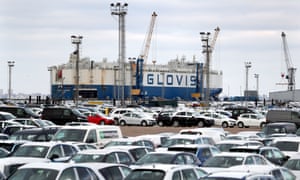 A car carrying ship delivers new cars to a compound near Sheerness in Kent