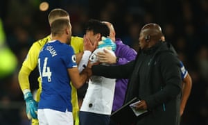 Son reacts as Gomes receives treatment on the field.