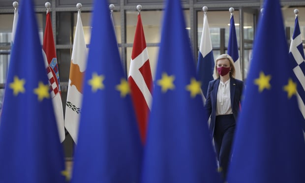 Liz Truss amid flags