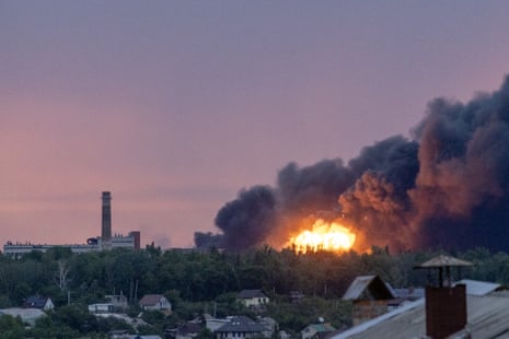 Fire is seen among the smoke clouds billowing from a Russian attack on Kharkiv, Ukraine on Satuday.