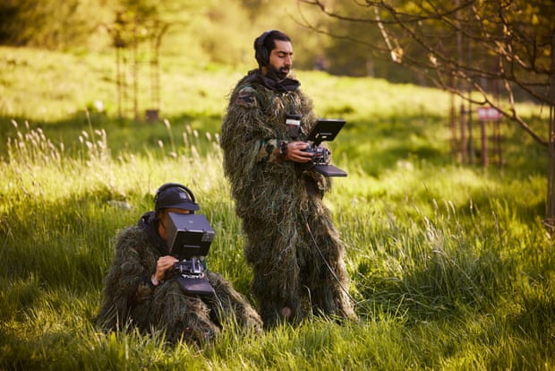 Drone pilot Ibrahim Serra-Mohammed (right) and drone camera operator Tom Elliott from Ascension Films wear full camouflage outfits during the filming of Wolf Alice’s set.