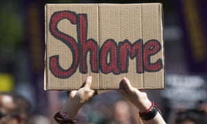 Activists hold protest signs during a rally against the Trump administration’s immigration policies. 4380.jpg?width=300&quality=85&auto=forma