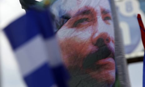 A banner emblazoned with an image of Daniel Ortega is waved in Managua. Nicaragua’s president has made an unexpected appearance as an issue in Brazil’s election.