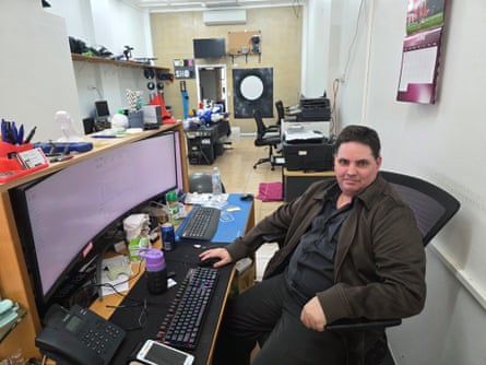 Paul Morgan sits at a computer