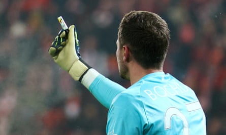 Bochum’s Patrick Drewes holds up the lighter which he says hit him in the Bundesliga game against Union Berlin.