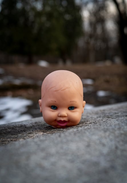 A doll’s head is pictured on a rock by some water at Midlothian, Illinois.