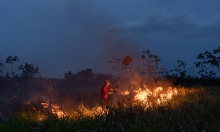 Firefighters battle a blaze near the city of Humaitá in Amazonas state.