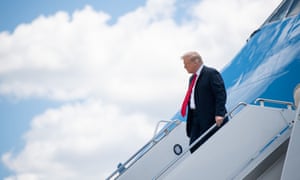 US President Donald Trump disembarks from Air Force One upon arrival at Austin Straubel International Airport in Green Bay, Wisconsin.