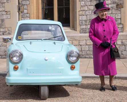 Queen Elizabeth II with a three-wheeled Invacar